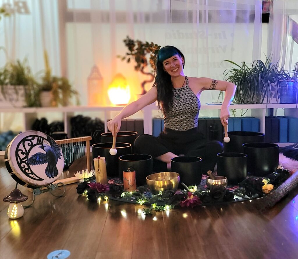 Sound healing session with crystal bowls at SoulSync Alchemy wellness sanctuary.